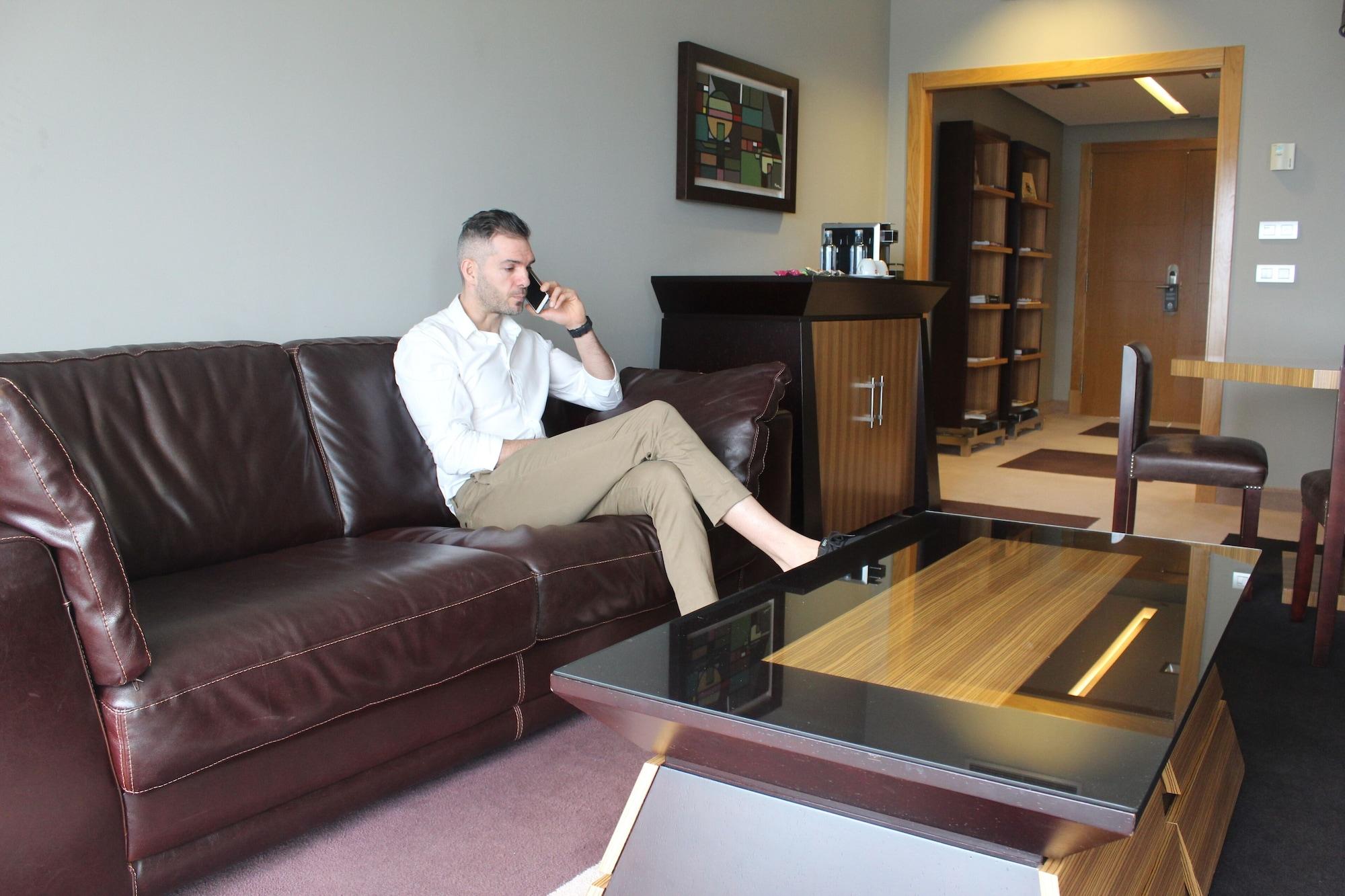 Pazo Los Escudos Hotel Spa & Resort Vigo Bagian luar foto A man sitting on a sofa
